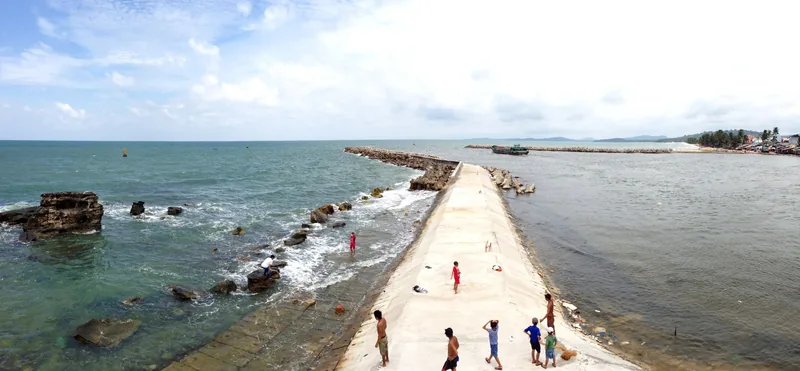 Children play on a concrete pier stretching into the sea near Duong Dong, Phu Quoc.